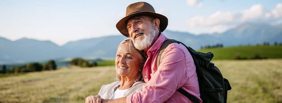 senior spouses embracing each other mountain views simple retirement strategy beacon financial williston vt